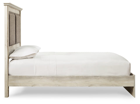 Cambeck King Upholstered Panel Bed with Mirrored Dresser