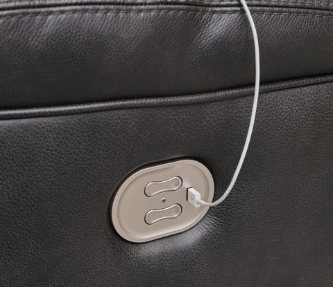 Black leather suitcase with a USB charging port on a dark background