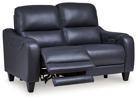 Blue leather recliner sofa on a white background