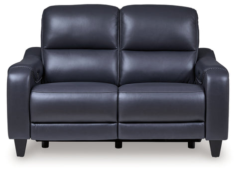 Blue leather loveseat on a white background